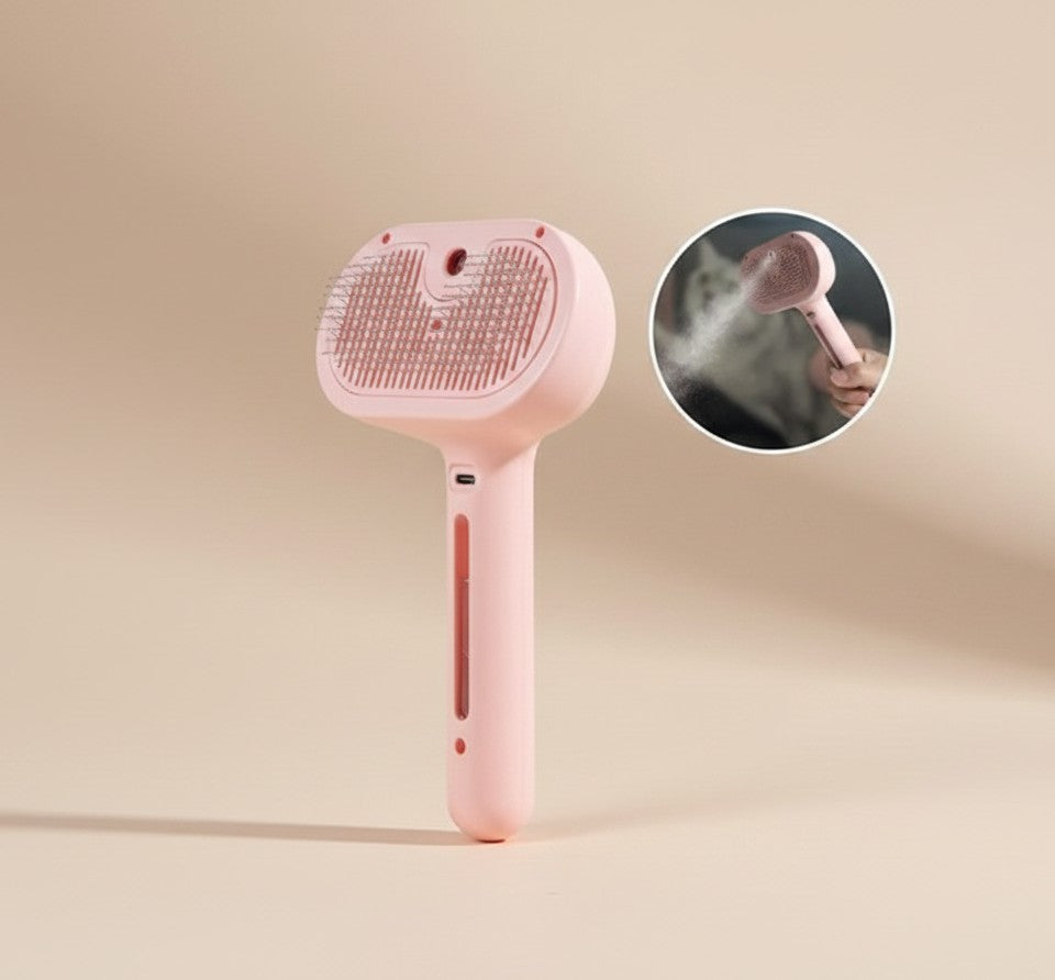 Nuzzle & Co pink 2-in-1 pet grooming spray brush with fine bristles and a refillable water tank for dogs and cats