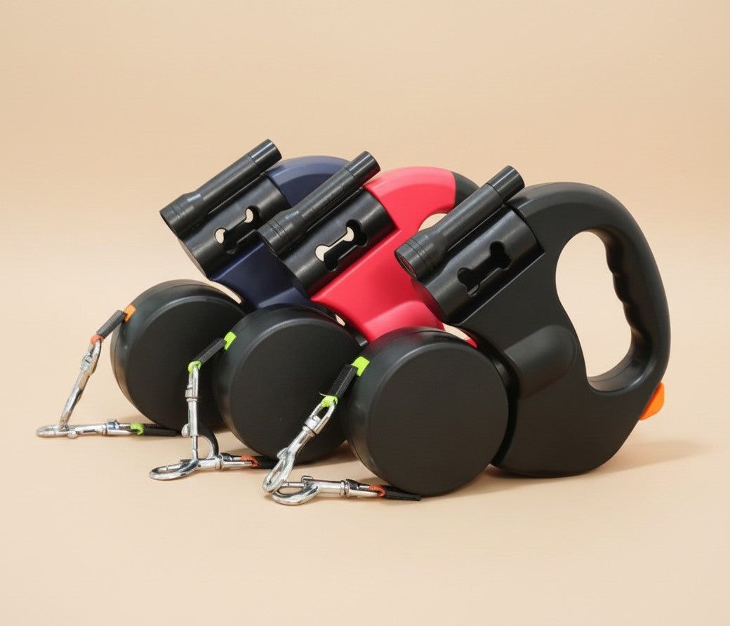 Nuzzle & Co retractable double dog leashes in black, red, and grey with built-in LED lights and comfort grip handles.