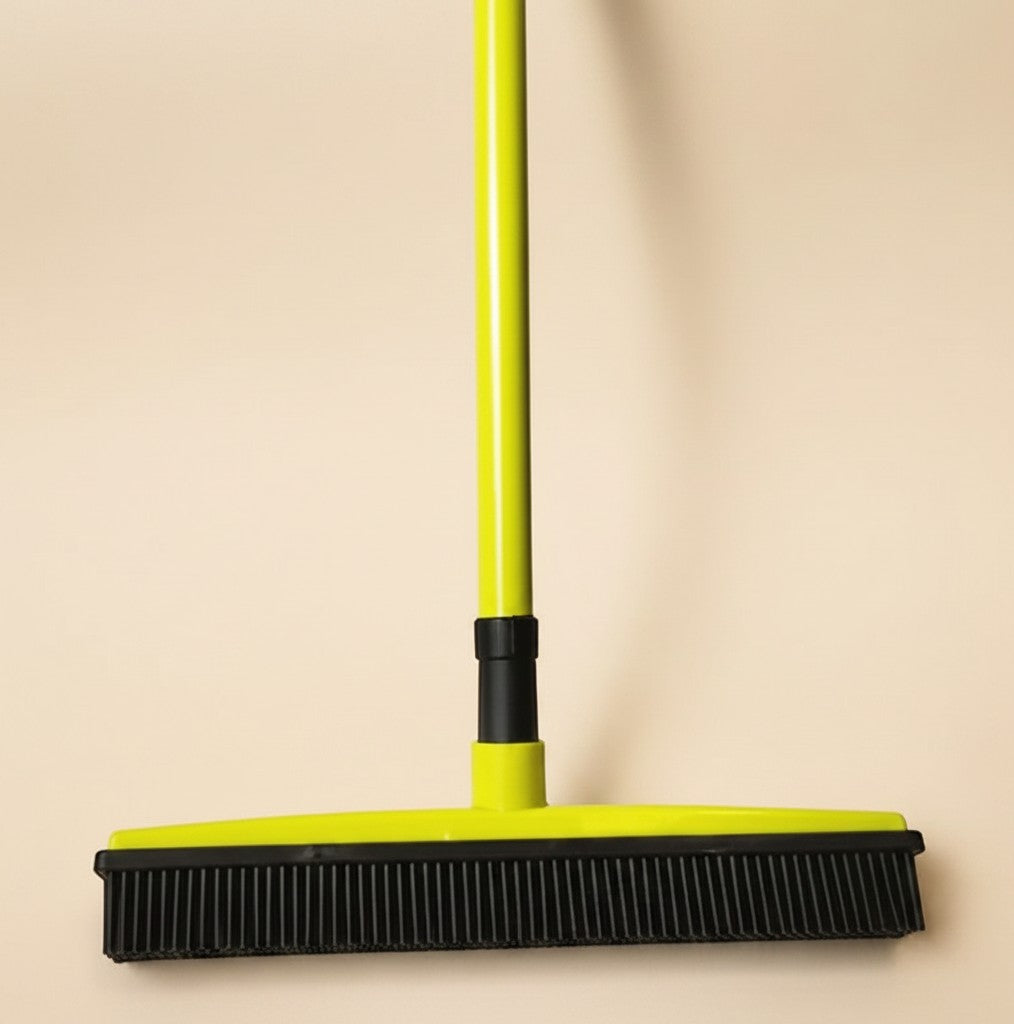 Nuzzle & Co lime green pet hair removal broom with black silicone bristles for carpets and hard floors