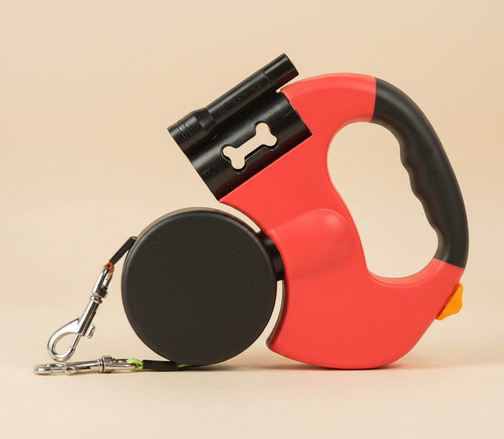 Nuzzle & Co red retractable double dog leash with built-in LED light and comfort grip handle on beige background